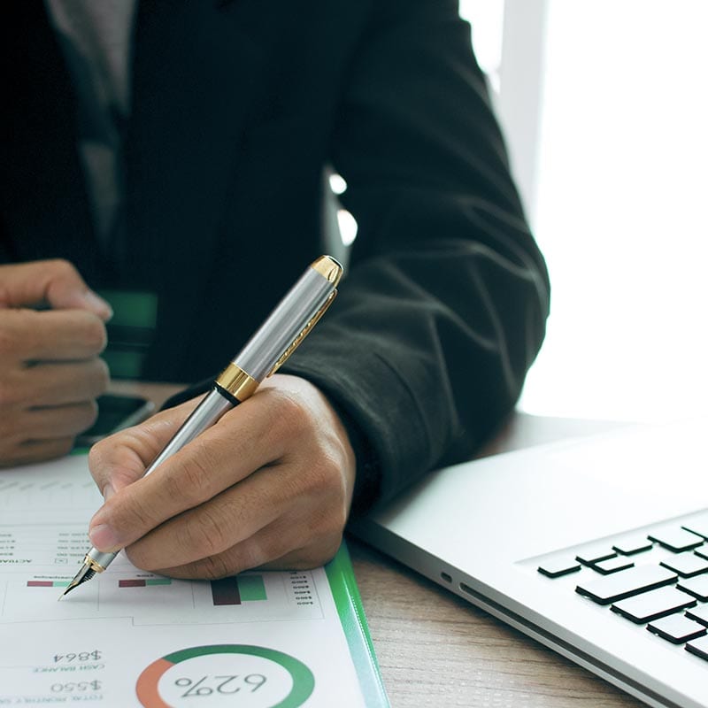 Neal's Accounting & Tax Service Businessman analyzing investment charts. Accounting